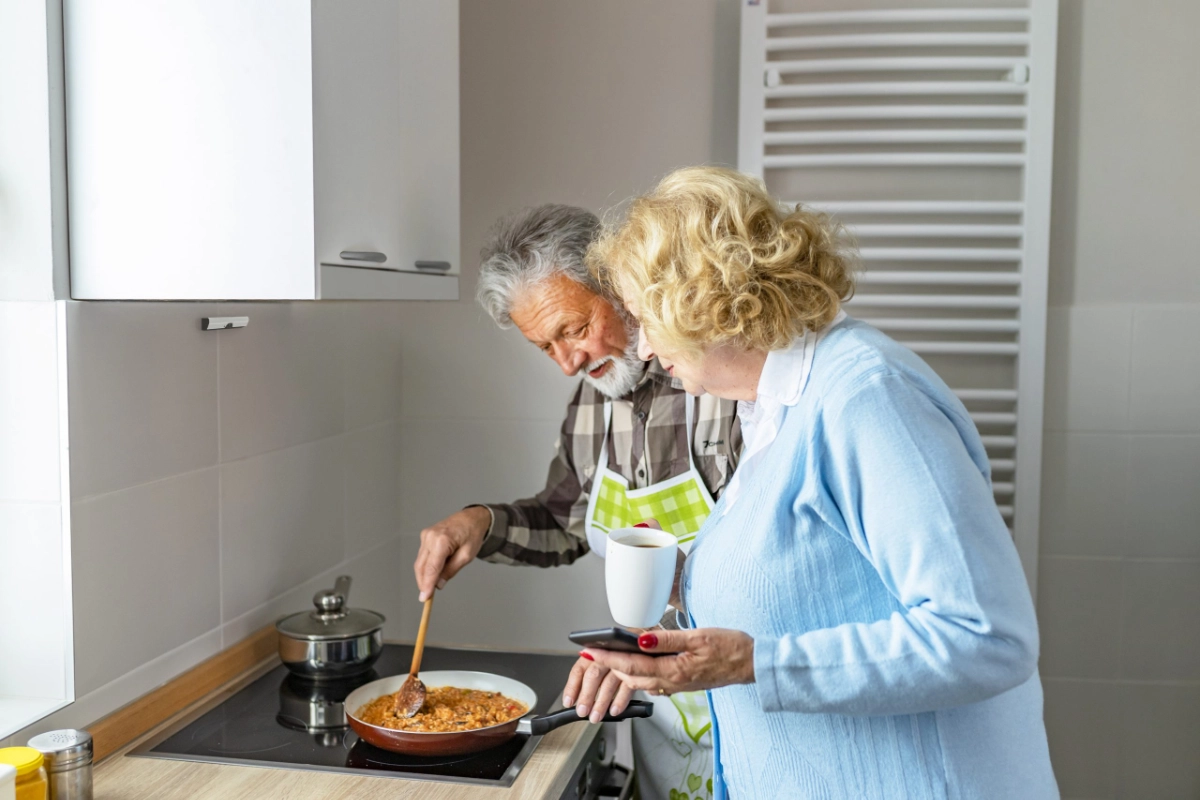 Airis protecting an elderly couple cooking on the hob